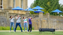 Some guests prepare to aim for a laser clay target