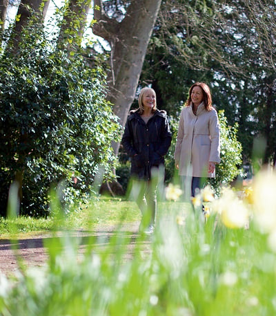 A couple of guests wandering through the grounds at Holme Lacy House