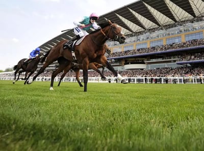 Two jockeys on horseback racing on the Ascot Racecourse