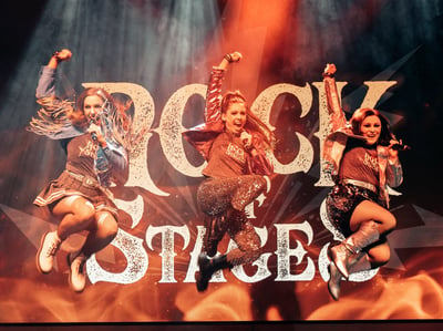 A vibrant performance of the Rock of Stages show, held at Heythrop Park Hotel