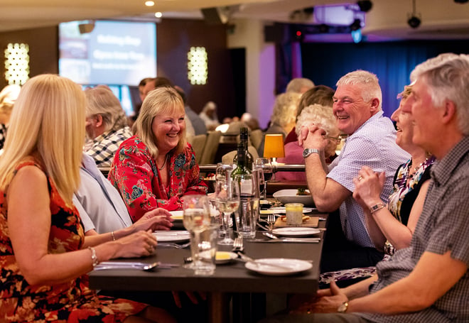 A group of guests dining together