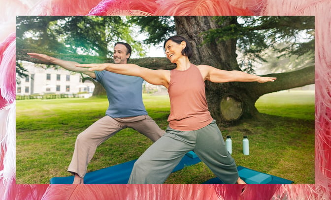 Mick and Angie laugh as they try yoga in the grounds of Heythrop Park, a Warner Hotel