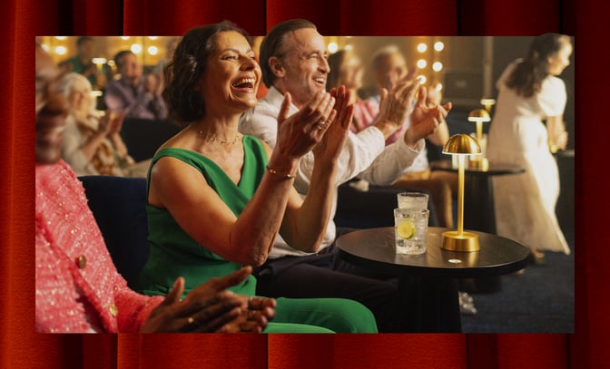 Couple enjoying the entertainment at a Warner Hotel