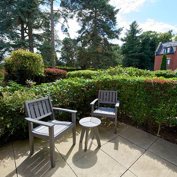 Patio furniture on a patio in a ground floor Signature room